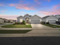 Charming single-story home featuring a well-manicured lawn and inviting curb appeal at 4340 Reding Way, Lakeland, FL 33813