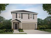 Charming two-story home featuring gray siding, black shutters, and a two-car garage in a Gathering-friendly neighborhood at 5112 Sylas Jax Ave, Winter Haven, FL 33884