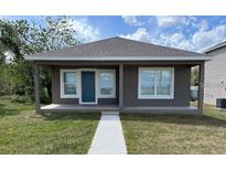 Charming single-story home featuring a covered front porch and a well-maintained lawn at 4042 Old Bartow Eagle Lake Rd, Bartow, FL 33830
