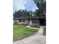 Charming single-story home with a well-maintained lawn and inviting walkway at 2708 Dixie Rd, Lakeland, FL 33801