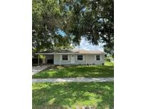 Charming one-story home with a well-maintained lawn and covered parking at 29 Coleman Rd, Winter Haven, FL 33880