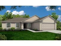 Charming one-story home with a well-manicured lawn and an attached garage at 35 Graner Dr, Frostproof, FL 33843