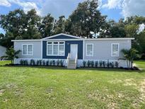 Charming single-story home featuring a well-manicured lawn and a welcoming front entrance at 3780 Pioneer Trails St, Lakeland, FL 33810