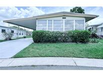 Charming single-story home with well-maintained lawn and mature landscaping at 622 Elizabeth Ln, Lakeland, FL 33809