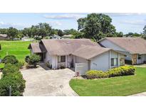 Charming single-story home with a well-maintained lawn and a paved driveway, offering inviting curb appeal at 849 Rockingham Rd, Lakeland, FL 33809