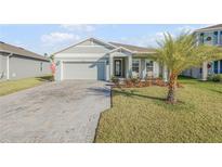 Charming single-Gathering home with a manicured lawn and a brick driveway, located in a desirable community at 270 Eagle Harbor Way, Daytona Beach, FL 32124