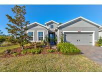 Beautiful house exterior with landscaping and a two-car garage at 1002 Chelan Falls Dr, Deland, FL 32724