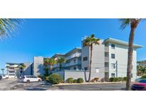 Ocean Ridge Condo building, featuring multiple stories and parking at 1571 S Atlantic Ave # 4110, New Smyrna Beach, FL 32169