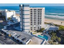 Oceanfront building with parking and pool; desirable location at 5207 S Atlantic Ave # 423, New Smyrna Beach, FL 32169