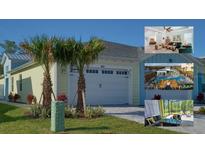 Charming home featuring a two-car garage and a beautifully landscaped front yard with palm trees at 667 Margaritaville Ave, Daytona Beach, FL 32124