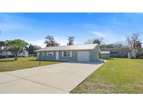 Newly renovated single story home with metal roof and large backyard at 1852 Sabal Palm Dr, Edgewater, FL 32141