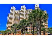 Coastal condo building with palm trees and ocean views at 257 Minorca Beach Way # 1603, New Smyrna Beach, FL 32169