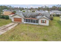 Ranch style home with pool and fenced backyard in residential neighborhood at 3039 Tamarind Dr, Edgewater, FL 32141