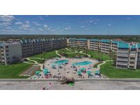 Aerial view of condo complex with pools, beach access, and recreational areas at 4501 S Atlantic Ave # 5180, New Smyrna Beach, FL 32169