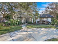 Charming single-story home with landscaped yard and circular driveway at 81 Alberta Ave, Ponce Inlet, FL 32127