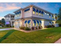 Two-story home with blue shutters and landscaped lawn at 224 Condict Dr, New Smyrna Beach, FL 32169