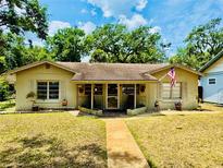 Charming single-story home with a well-maintained lawn and inviting walkway at 314 Hillman St, New Smyrna Beach, FL 32168