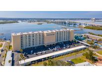 Admiralty Club building aerial view, showcasing its waterfront location and ample parking at 3606 S Peninsula Dr # 809, Port Orange, FL 32127