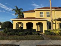 Charming two-story home with a welcoming front porch and well-maintained landscaping at 404 N Airport Rd, New Smyrna Beach, FL 32168