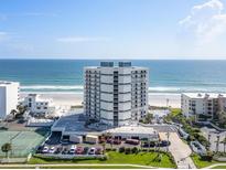 Aerial perspective showcasing beachfront building and surroundings at 5207 S Atlantic Ave # 626, New Smyrna Beach, FL 32169