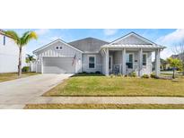 Curb appeal abounds in this charming one-story home with a welcoming front porch at 6807 Ragatz Ln, Port Orange, FL 32128