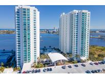 Stunning aerial view of two modern high-rise condo buildings with blue balconies overlooking the water at 231 Riverside Dr # 1509-1, Holly Hill, FL 32117