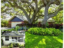 Charming home with mature trees, colorful landscaping, and well-maintained lawn at 4426 Saxon Dr, New Smyrna Beach, FL 32169
