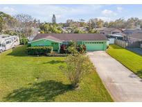 Charming green single-story home with well-manicured lawn and inviting curb appeal at 921 Duncan Rd, South Daytona, FL 32119