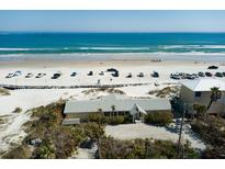 Aerial view showcasing this beachfront home's location and proximity to the ocean at 921 N Atlantic Ave, New Smyrna Beach, FL 32169