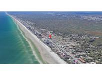 An aerial view showcases this coastal community by the beach near local attractions at 3700 S Atlantic Ave # 315, New Smyrna Beach, FL 32169