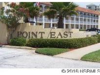 Well-maintained condominium complex with beautiful landscaping and mature trees at 3801 S Atlantic Ave # Ut125, New Smyrna Beach, FL 32169