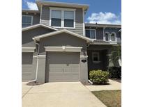 Two story townhome featuring a garage and neutral color palette at 612 Mount Olympus Blvd, New Smyrna Beach, FL 32168