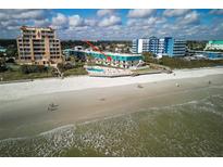Stunning beachfront condo featuring a pool, beach access, and picturesque ocean views at 701 S Atlantic Ave # 11, New Smyrna Beach, FL 32169