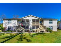Charming condo with dual screened patios and lush landscaping on a bright, sunny day at 1600 Big Tree Rd # G3, South Daytona, FL 32119