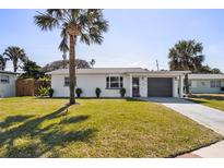 Charming single-story home with a well-manicured lawn and inviting curb appeal at 38 Seacrest Dr, Ormond Beach, FL 32176