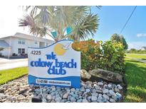 Colony Beach Club sign with palm tree and well maintained landscaping at 4225 S Atlantic Ave # 2070, New Smyrna Beach, FL 32169