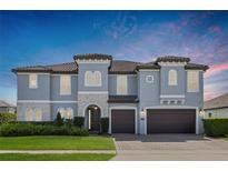 Stunning two-story home with a well-manicured lawn and a three-car garage at 465 White Cotton Cir, Oviedo, FL 32765