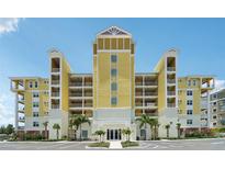 Stunning, multi-story condominium building with covered patios and manicured landscaping at 7 Riverwalk Dr # 206, New Smyrna Beach, FL 32169