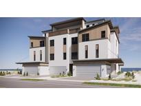 Beautifully designed three-story condo featuring a balcony, modern finishes and an attached garage at 3403 S Atlantic Ave # 3, New Smyrna Beach, FL 32169