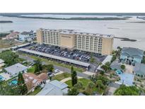 Aerial view of the Admiralty Club condo building with covered parking and beautiful waterfront views at 3606 S Peninsula Dr # 509, Port Orange, FL 32127