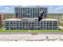 Oceanfront condo with multiple balconies overlooking the beach and a communal swimming pool at 4139 S Atlantic Ave # A504, New Smyrna Beach, FL 32169