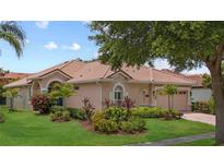 Beautiful one-story home featuring mature landscaping, a barrel tile roof, and neutral stucco siding at 11222 Rapallo Ln, Windermere, FL 34786