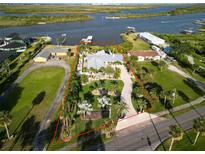 Gorgeous waterfront home with lush landscaping, private boat dock and city views at 1601 S Riverside Dr, Edgewater, FL 32132