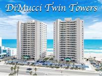DiMucci Twin Towers oceanfront condos with beautiful views of the beach, palm trees, and coastal highway at 3311 S Atlantic Ave # 801, Daytona Beach, FL 32118