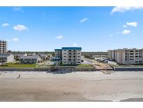 Stunning beachfront condo with ocean views, a pool, and ample parking for residents and guests at 4201 S Atlantic Ave # 402, New Smyrna Beach, FL 32169