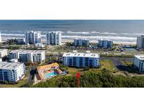 Coastal condominiums offer beach access with a pool and tennis courts at 5300 S Atlantic Ave # 17-207, New Smyrna Beach, FL 32169