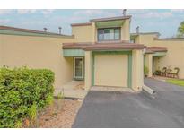 Inviting home featuring a one-car garage and manicured landscaping at 257 Club House Blvd, New Smyrna Beach, FL 32168