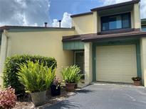 Inviting home featuring manicured landscaping and attached one car garage at 257 Club House Blvd, New Smyrna Beach, FL 32168