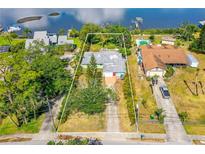 Aerial view of the property showing its proximity to the water and surrounding neighborhood at 2576 Sunset Dr, New Smyrna Beach, FL 32168