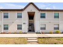 Inviting exterior of a multi-Gathering home with a well-maintained walkway and landscaped yard at 412 Banana Cay Dr # A, South Daytona, FL 32119